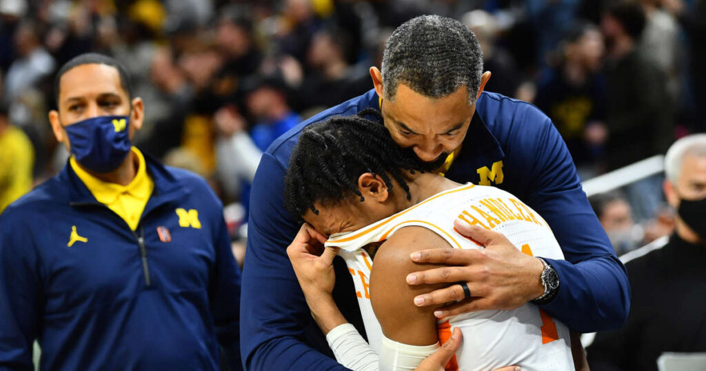 Michigan coach Juwan Howard comforts crying Tennessee star Kennedy Chandler after NCAA Tournament game
